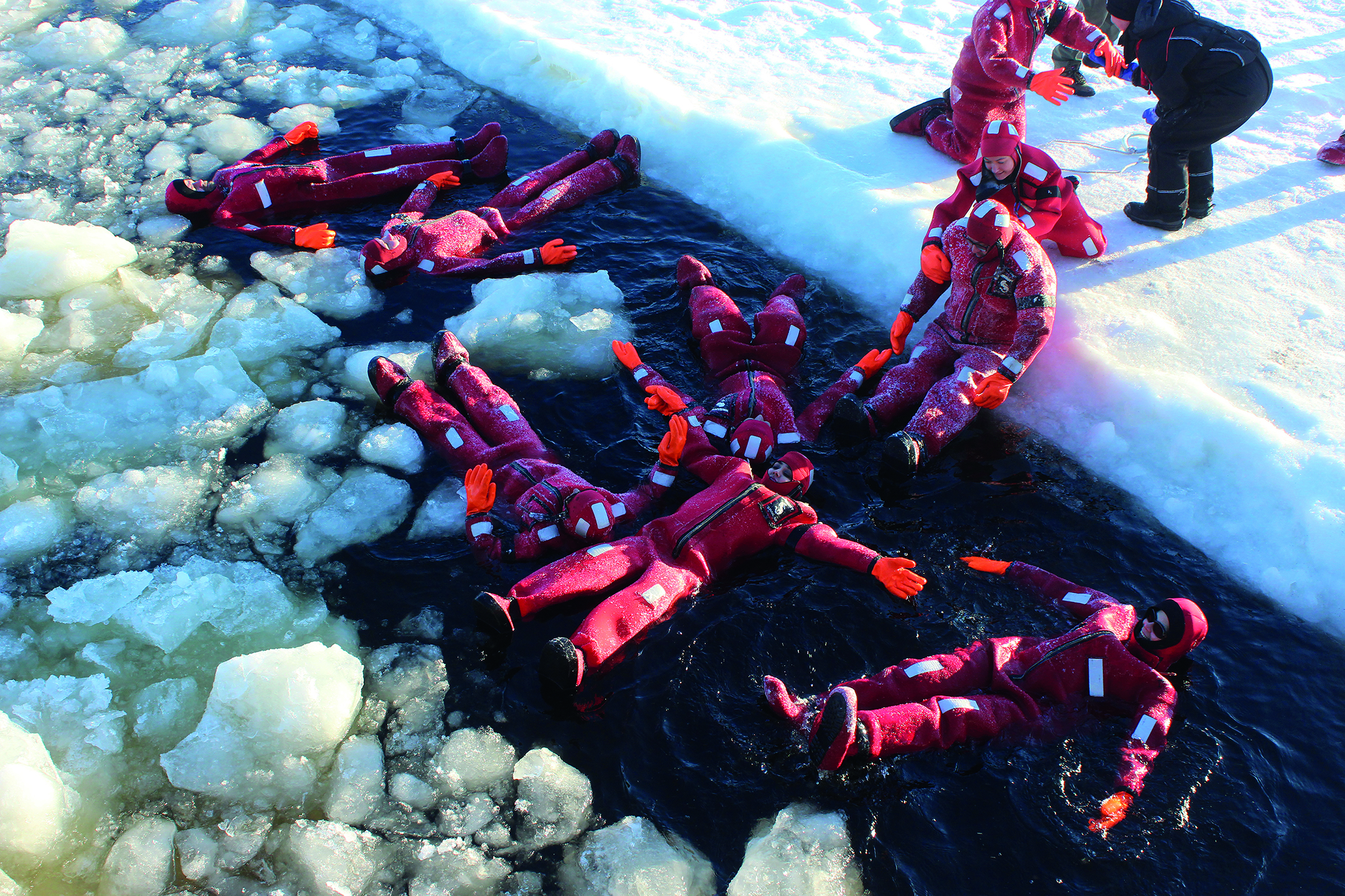 Tourists ice floating near the icebreaker Sampo.